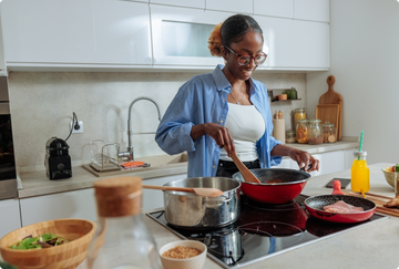 Woman cooking an iron-rich meal at home