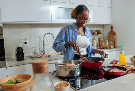 Woman cooking an iron-rich meal at home